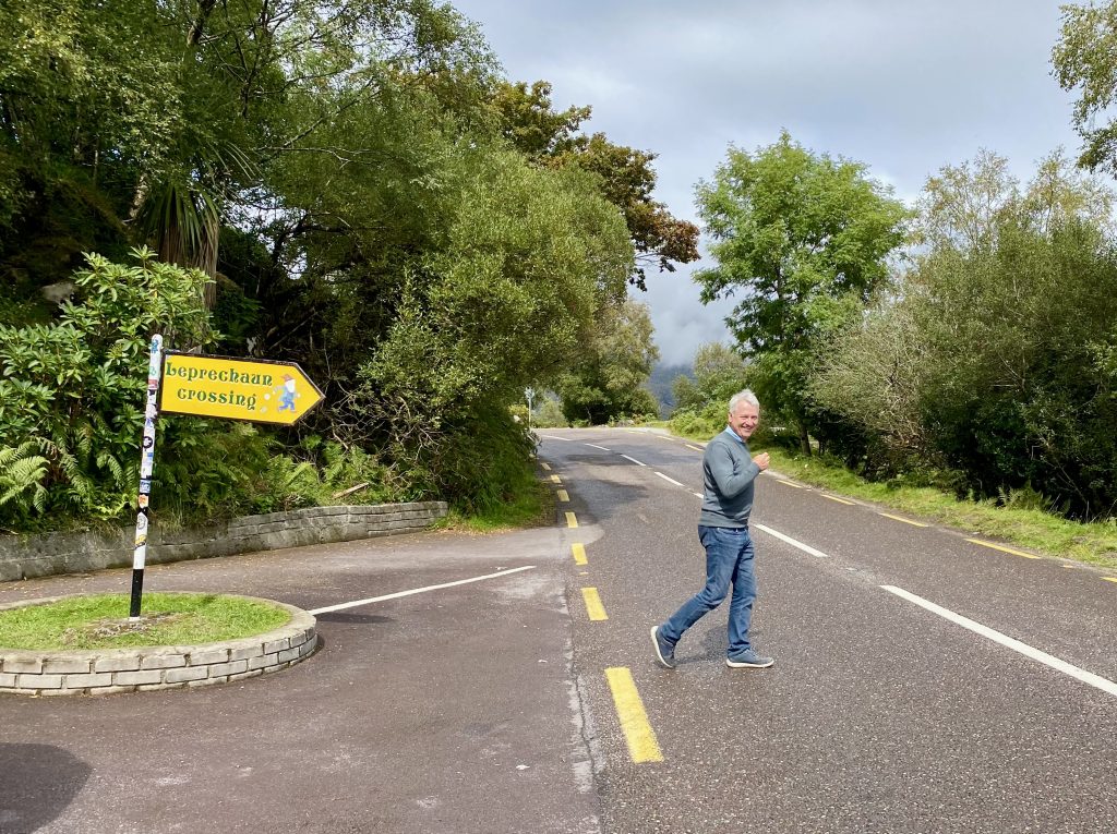 tom daly at leprechaun crossing sign